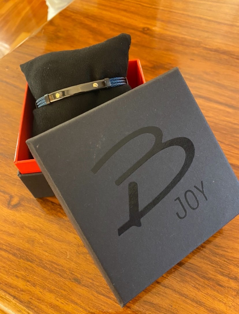 Bracciale uomo in acciaio con barretta con viti in oro