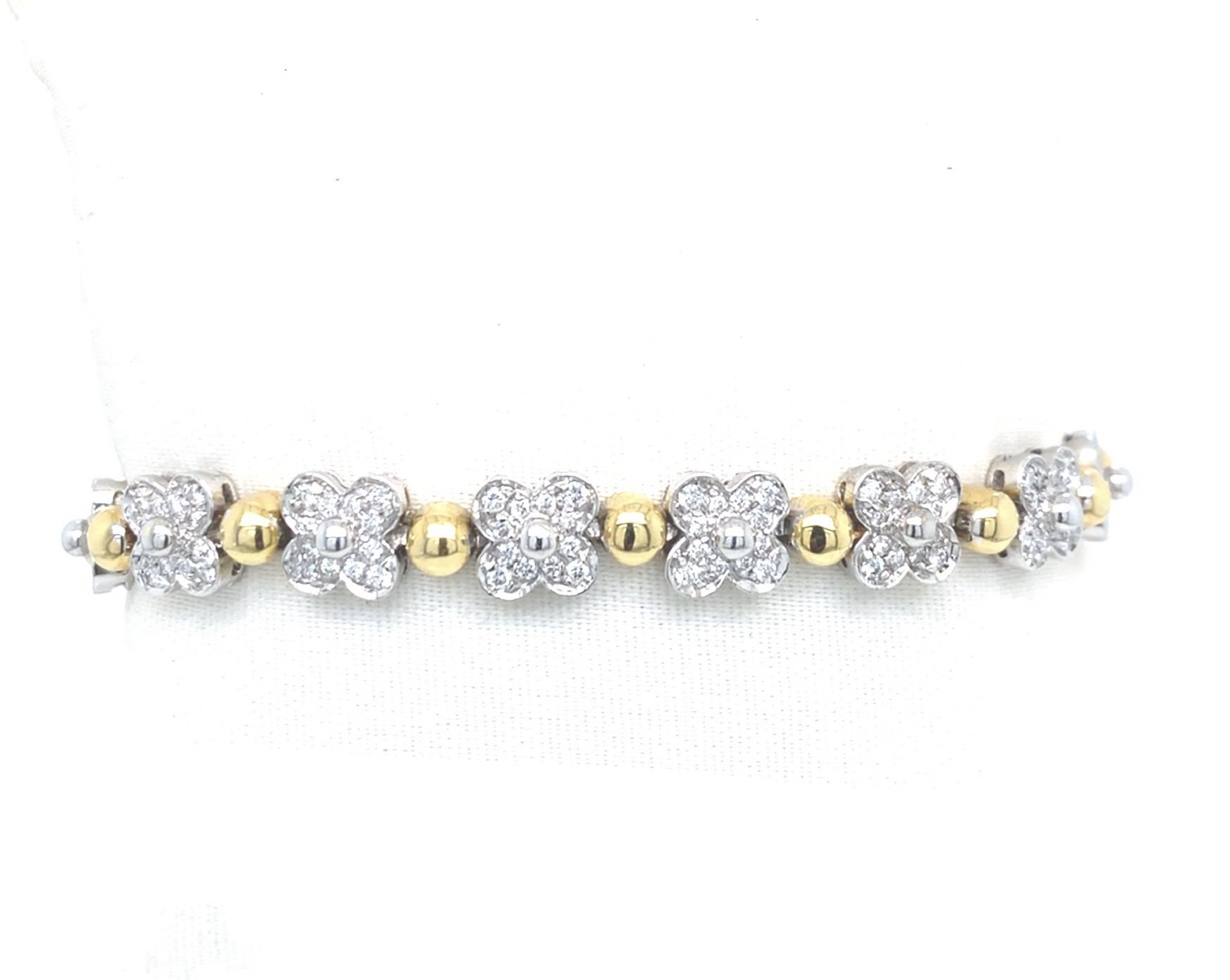Bracciale in oro giallo con fiori in diamanti
