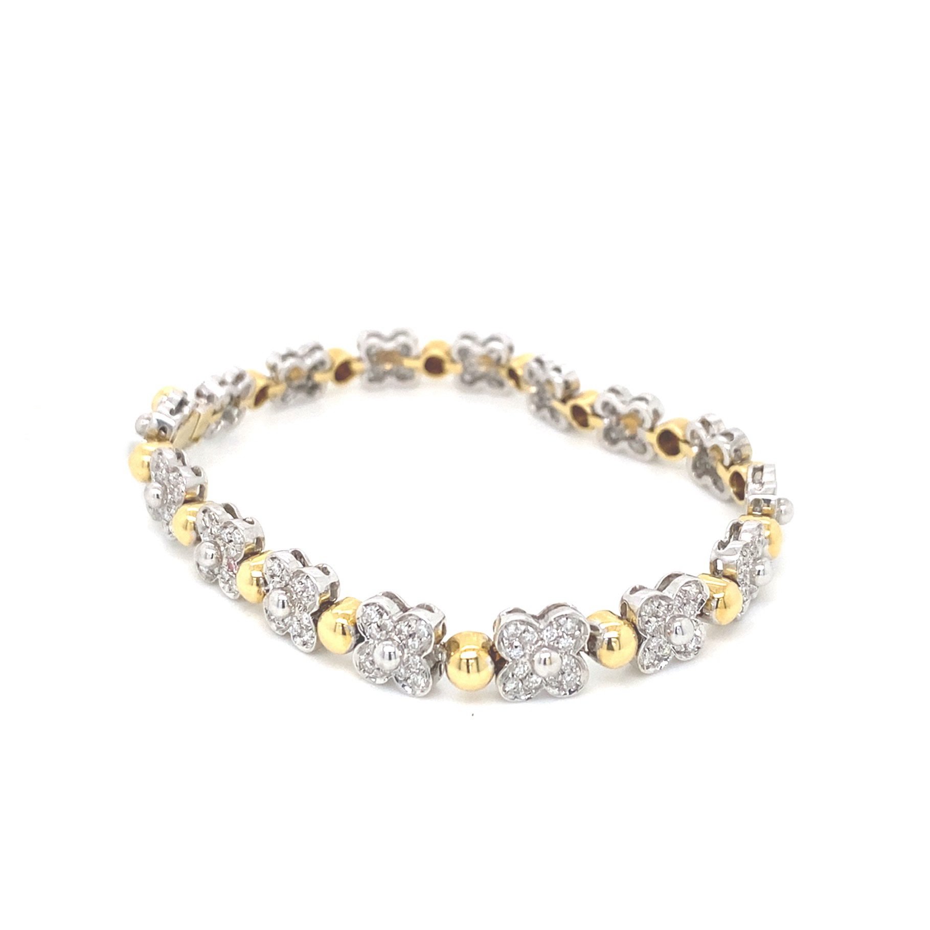 Bracciale in oro giallo con fiori in diamanti